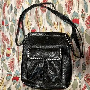 Black tooled cross body purse, long strap, outside pocket